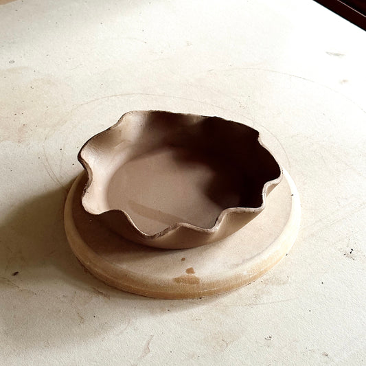 Wavy handmade dish made with Fin Pottery Tools pottery forms moulds.