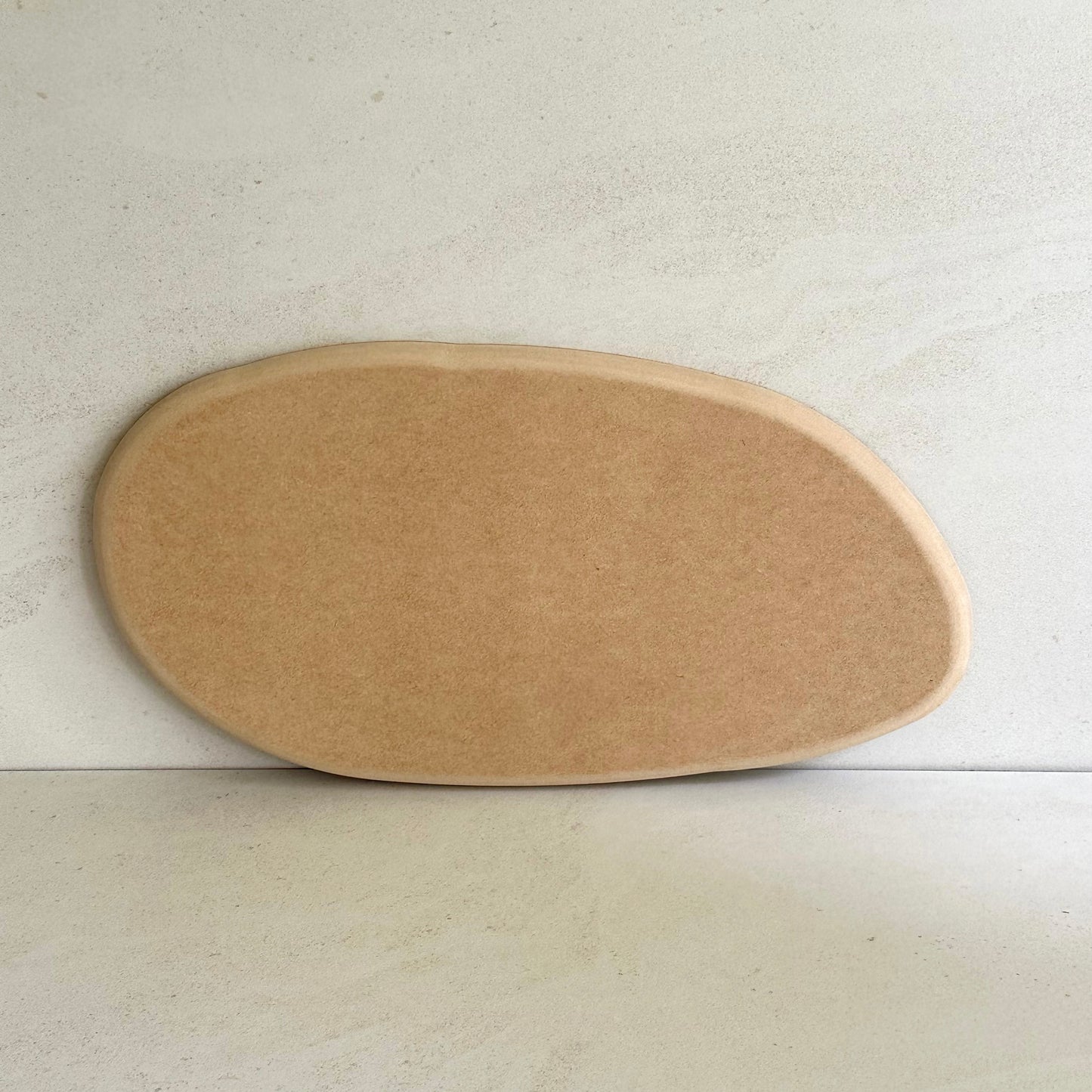 Irregular oval pottery form/drape mould with soft roundover edge. Available in two sizes.