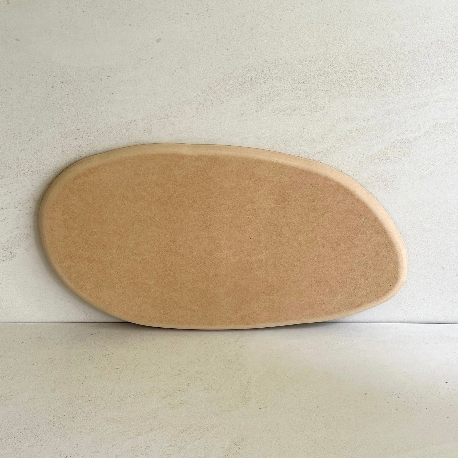 Irregular oval pottery form/drape mould with soft roundover edge. Available in two sizes.