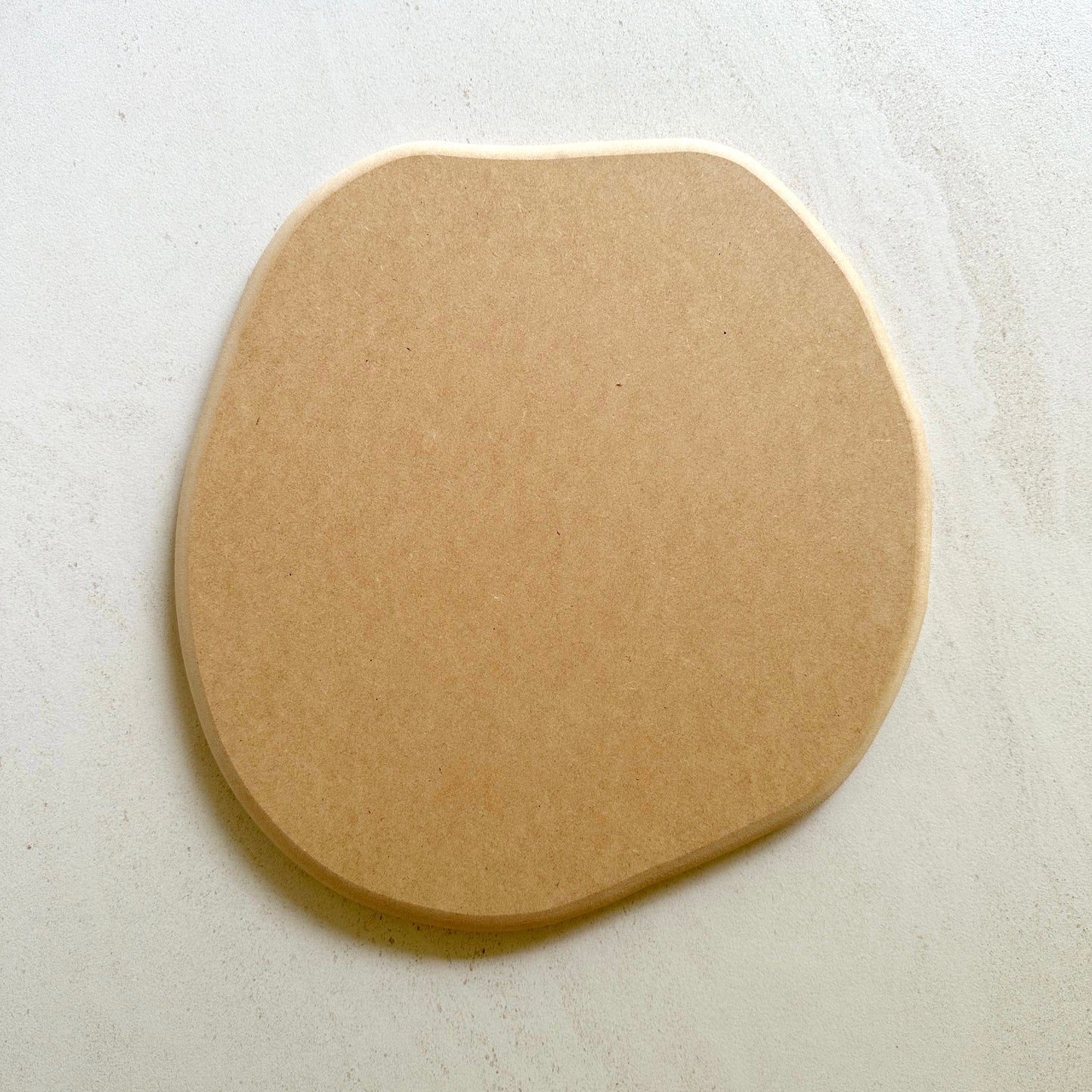 Irregular round pottery form/drape mould with soft roundover edge.