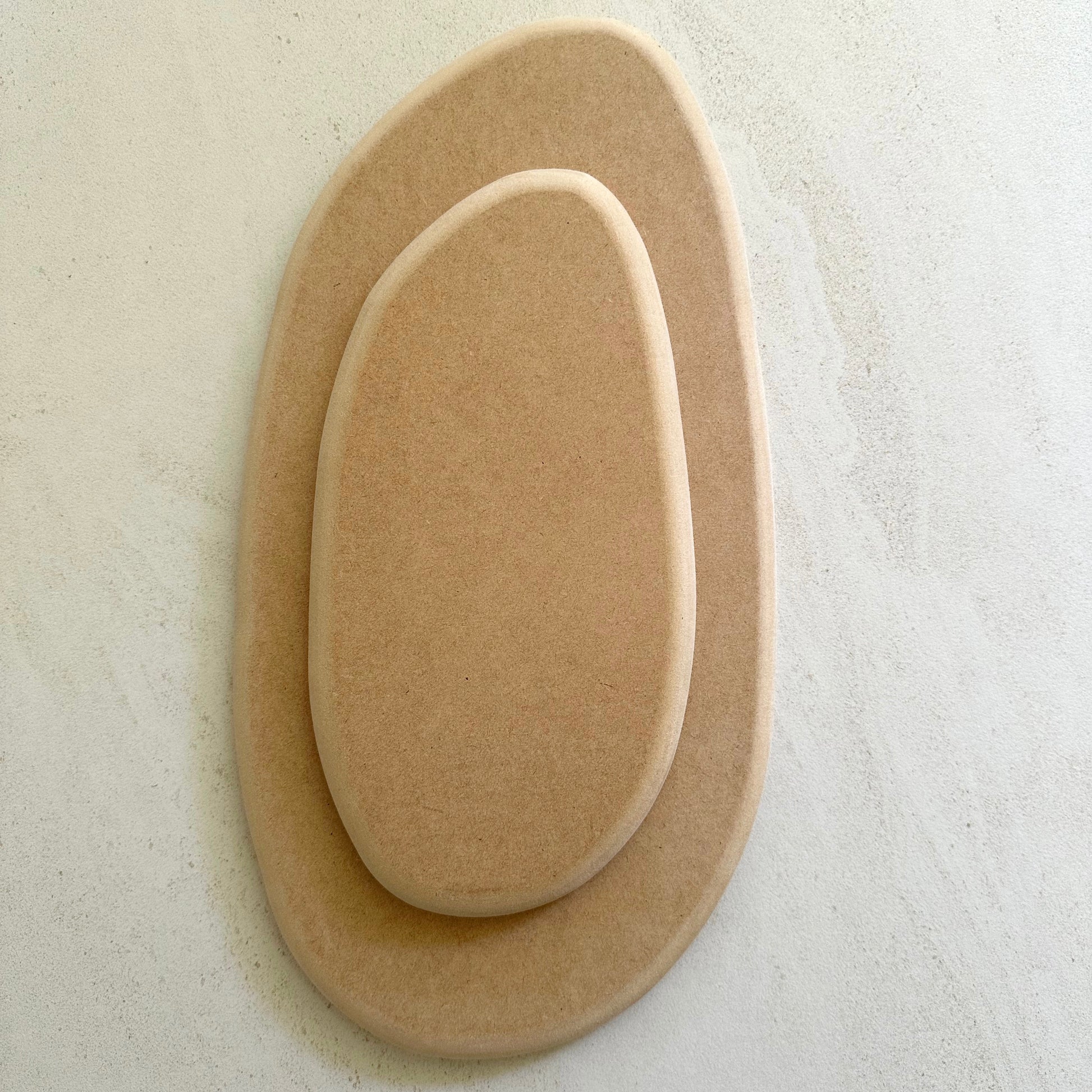 Irregular oval pottery form/drape mould with soft roundover edge. Available in two sizes.