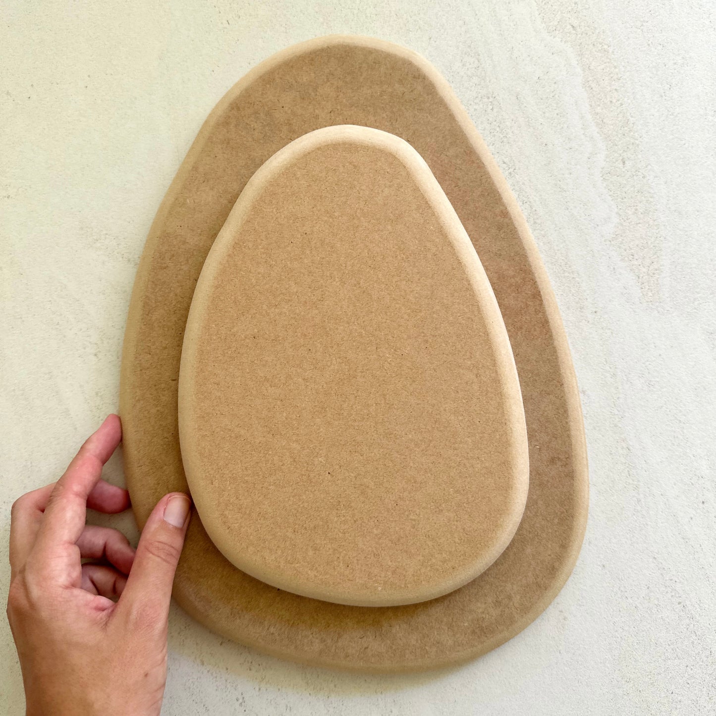 Rounded triangular oval pottery form/drape mould with soft roundover edge. Available in two sizes.