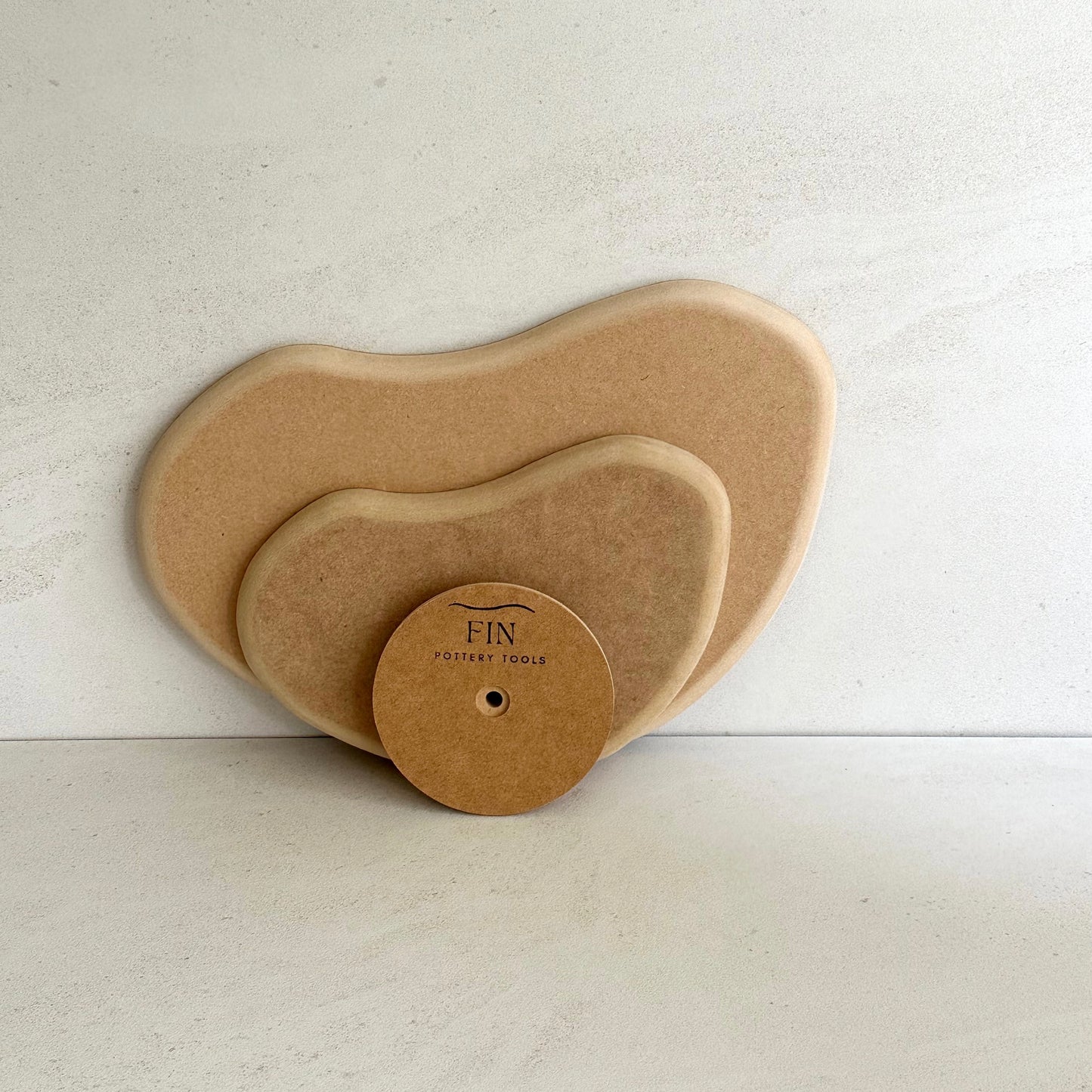 Bean-shaped pottery form drape mould with soft roundover edge. Available in two sizes.