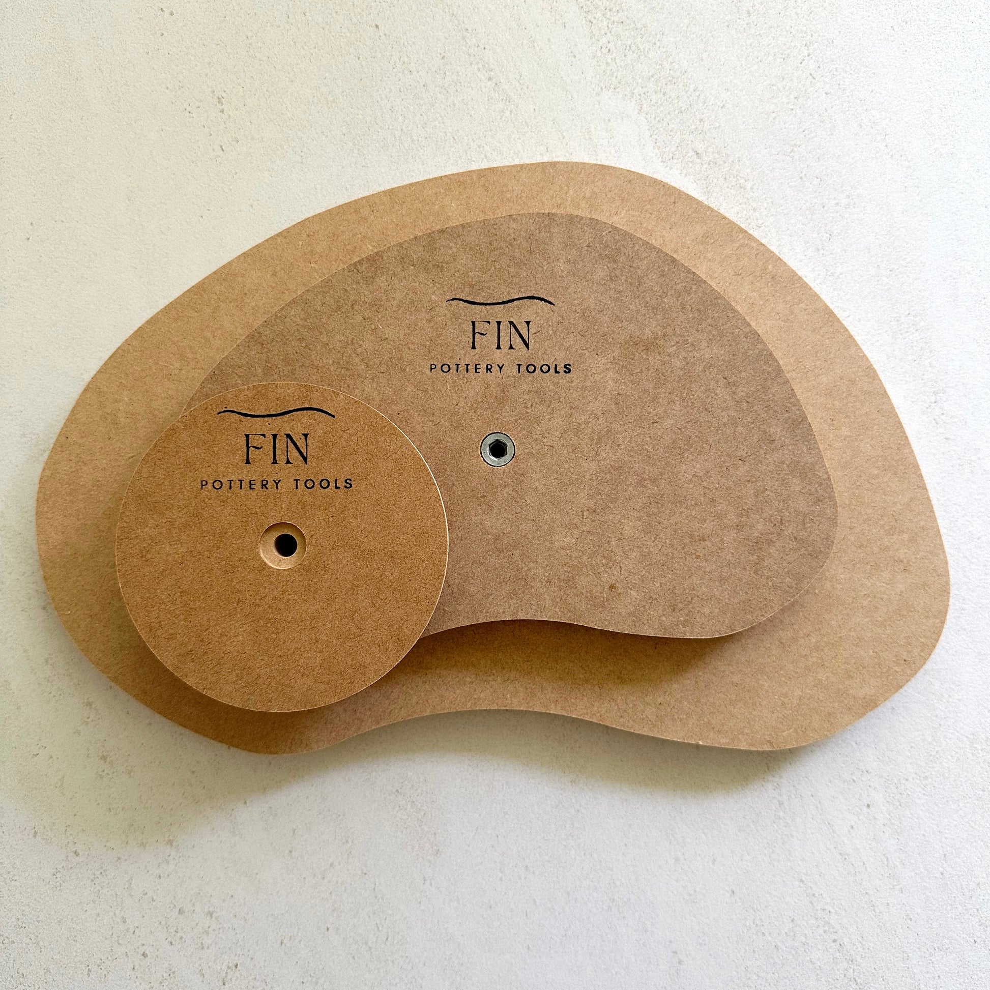 Bean-shaped pottery form drape mould with soft roundover edge. Available in two sizes.