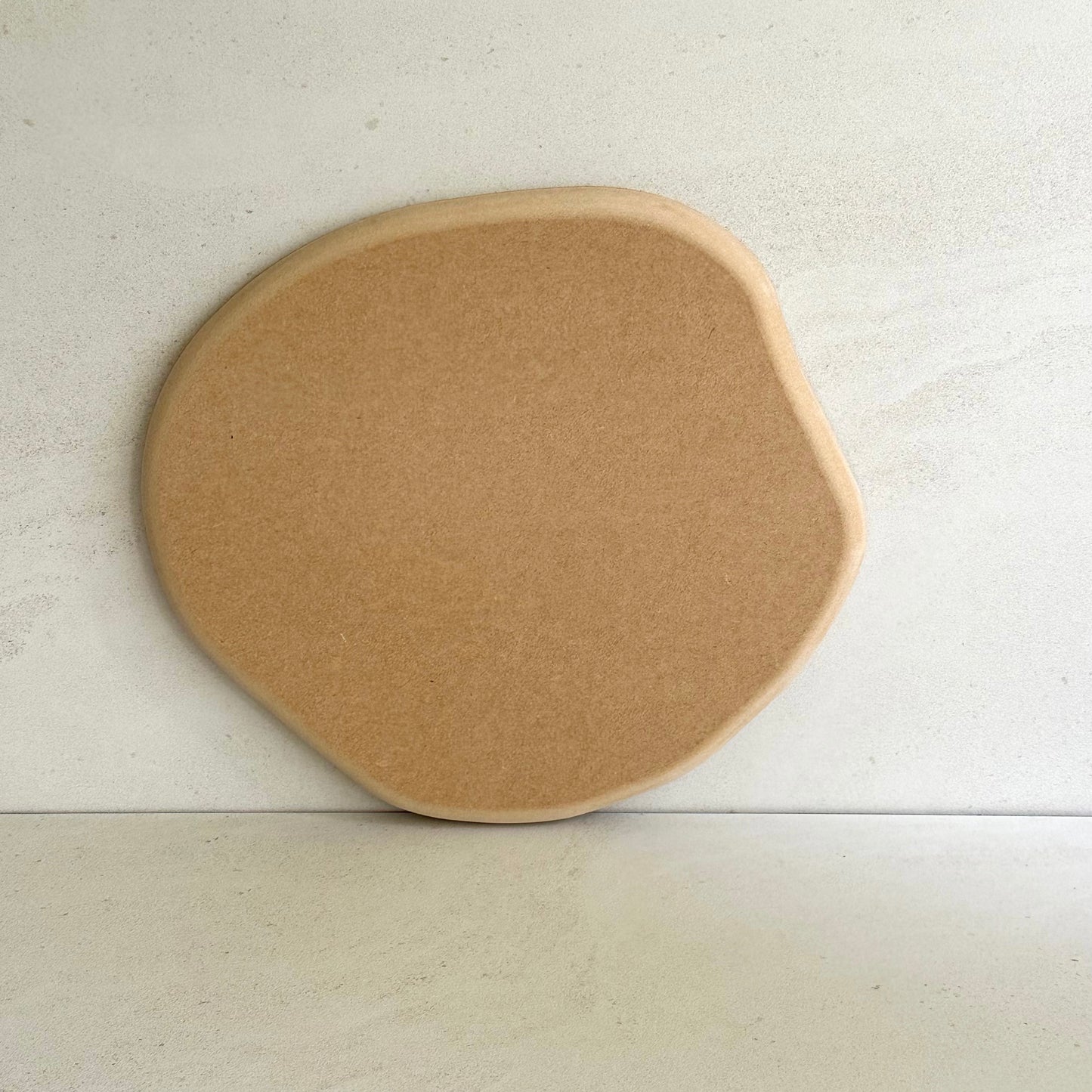 Irregular round pottery form/drape mould with soft roundover edge.