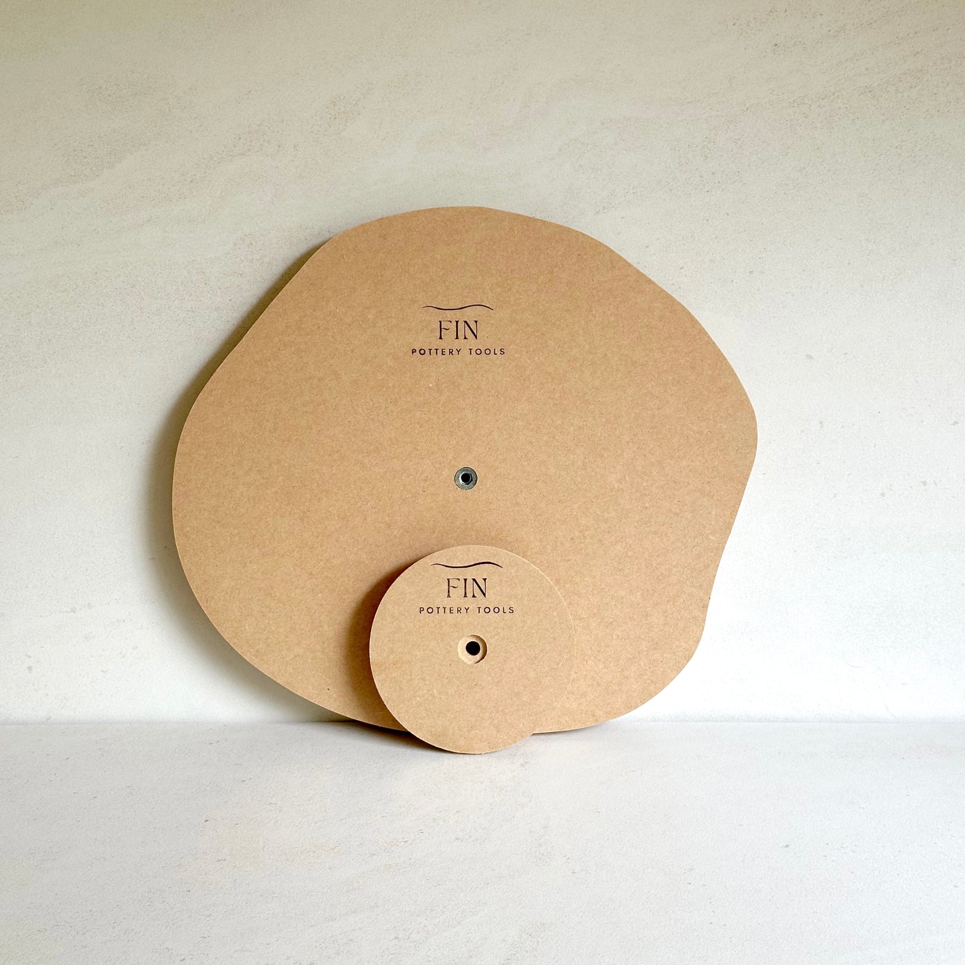 Irregular round pottery form/drape mould with soft roundover edge.