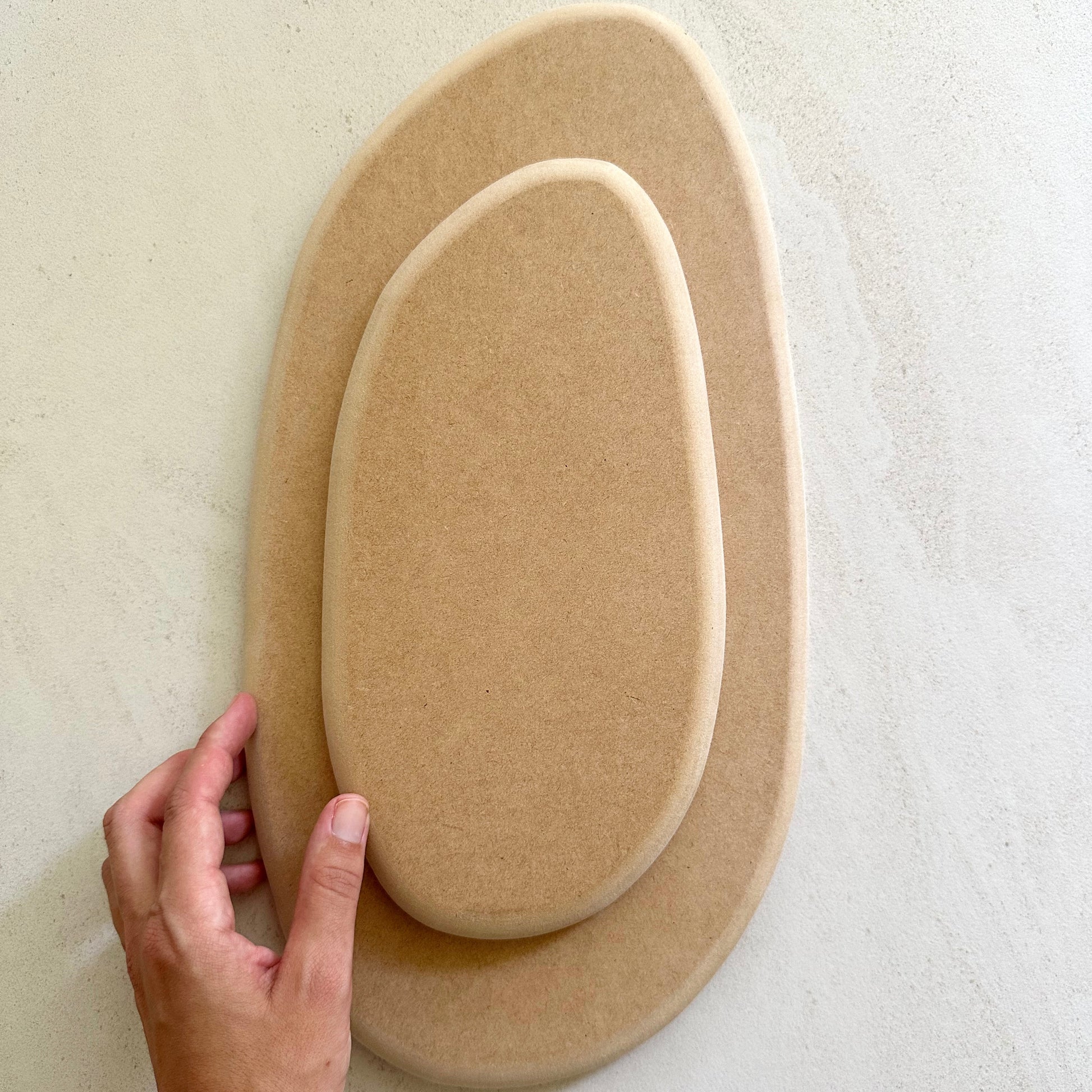 Irregular oval pottery form/drape mould with soft roundover edge. Available in two sizes.
