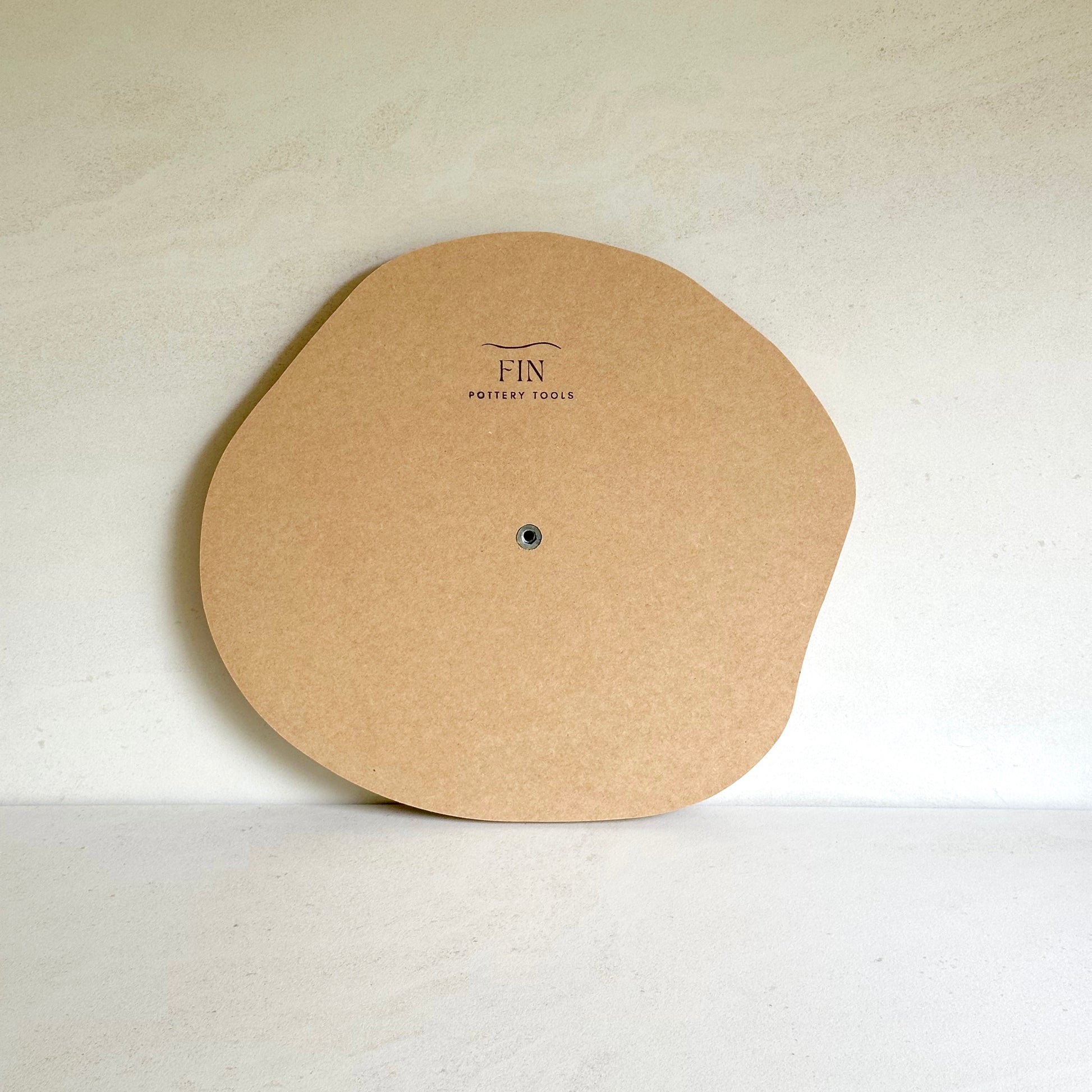 Irregular round pottery form/drape mould with soft roundover edge.