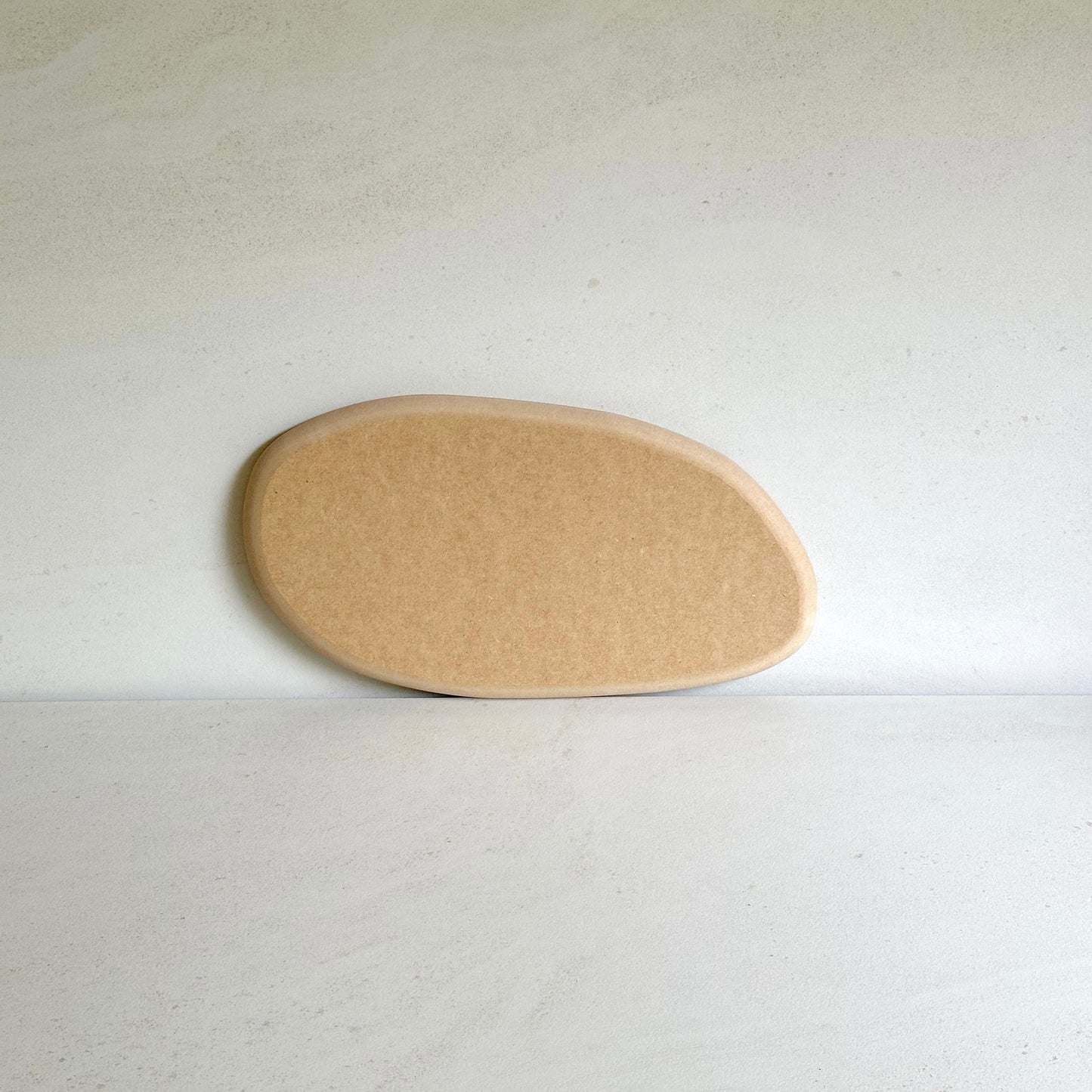 Irregular oval pottery form/drape mould with soft roundover edge. Available in two sizes.