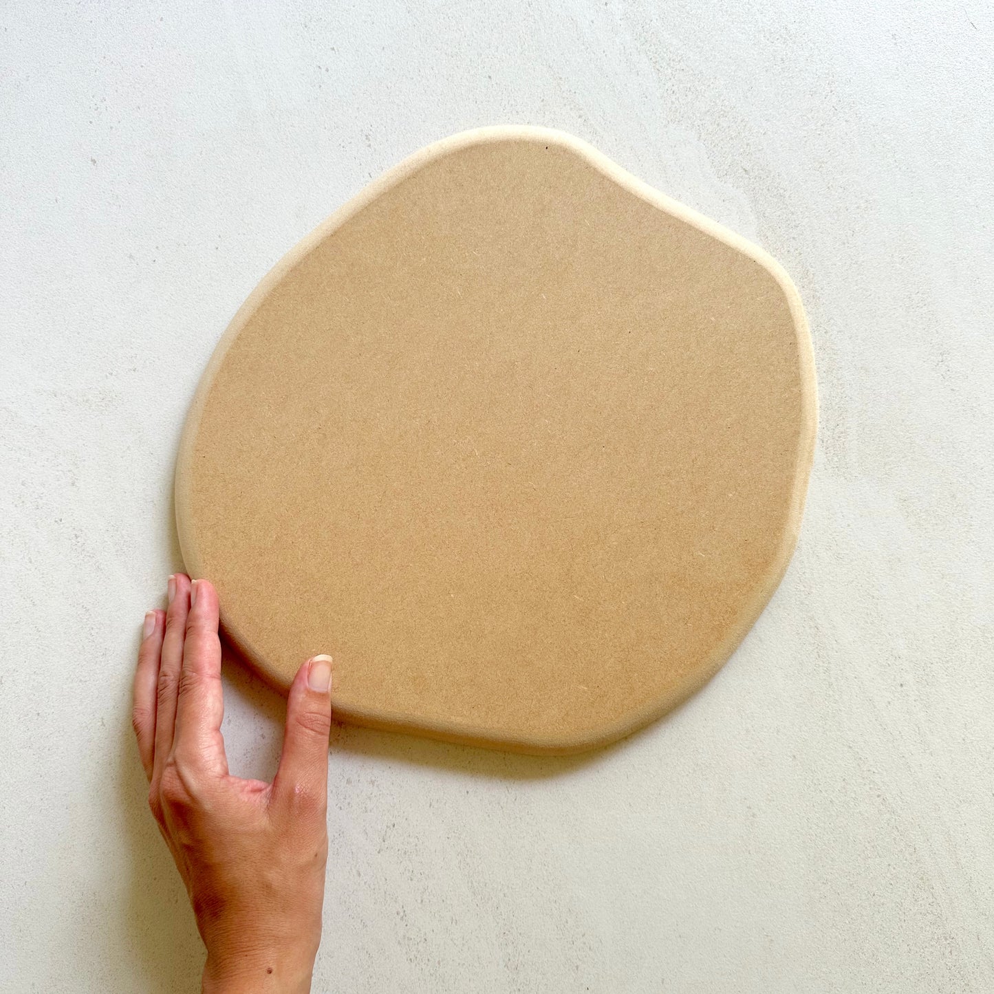 Irregular round pottery form/drape mould with soft roundover edge.