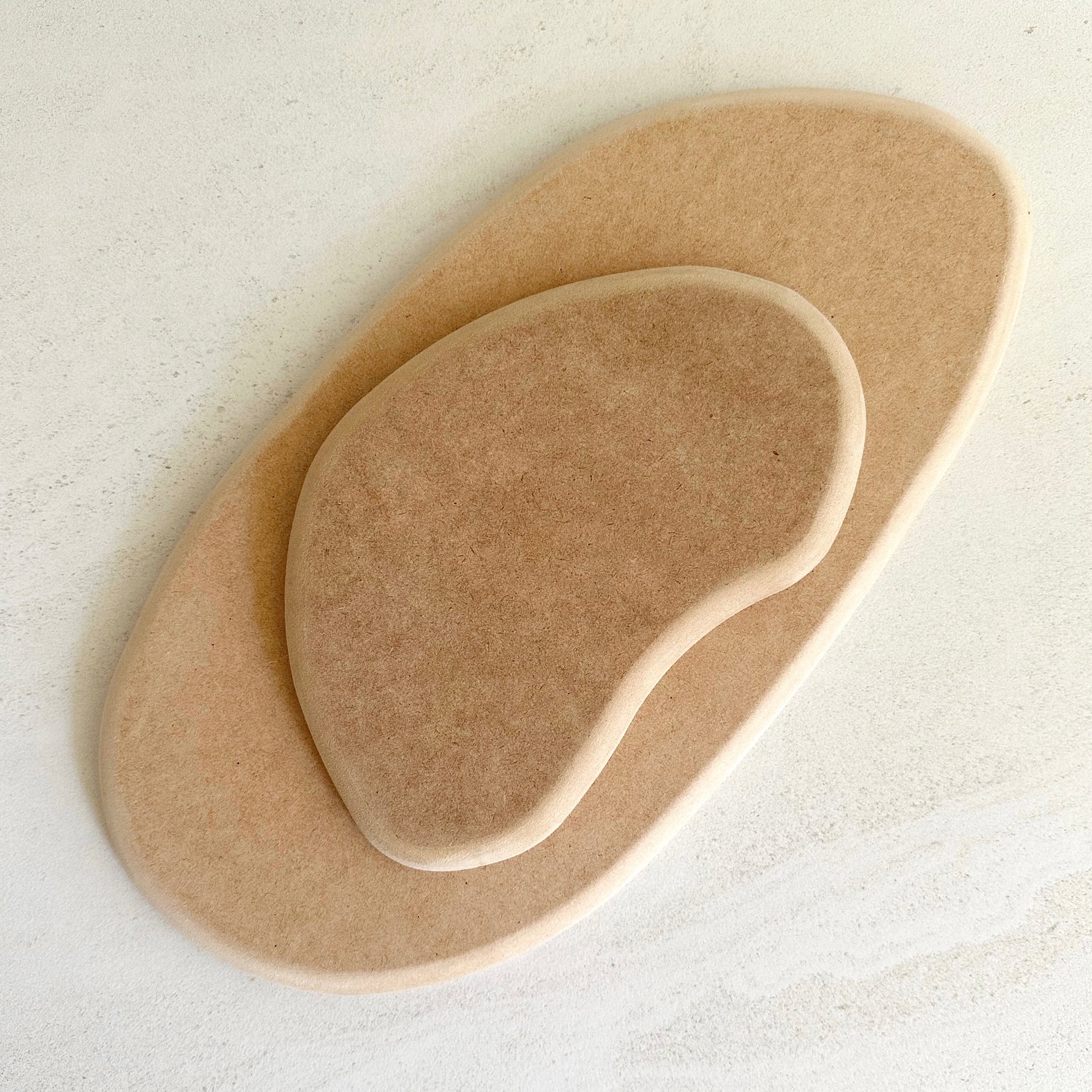 Irregular pottery forms inspired by the asymmetrical, beautifully unpredictable shapes found in nature, which are designed to nest within each other.