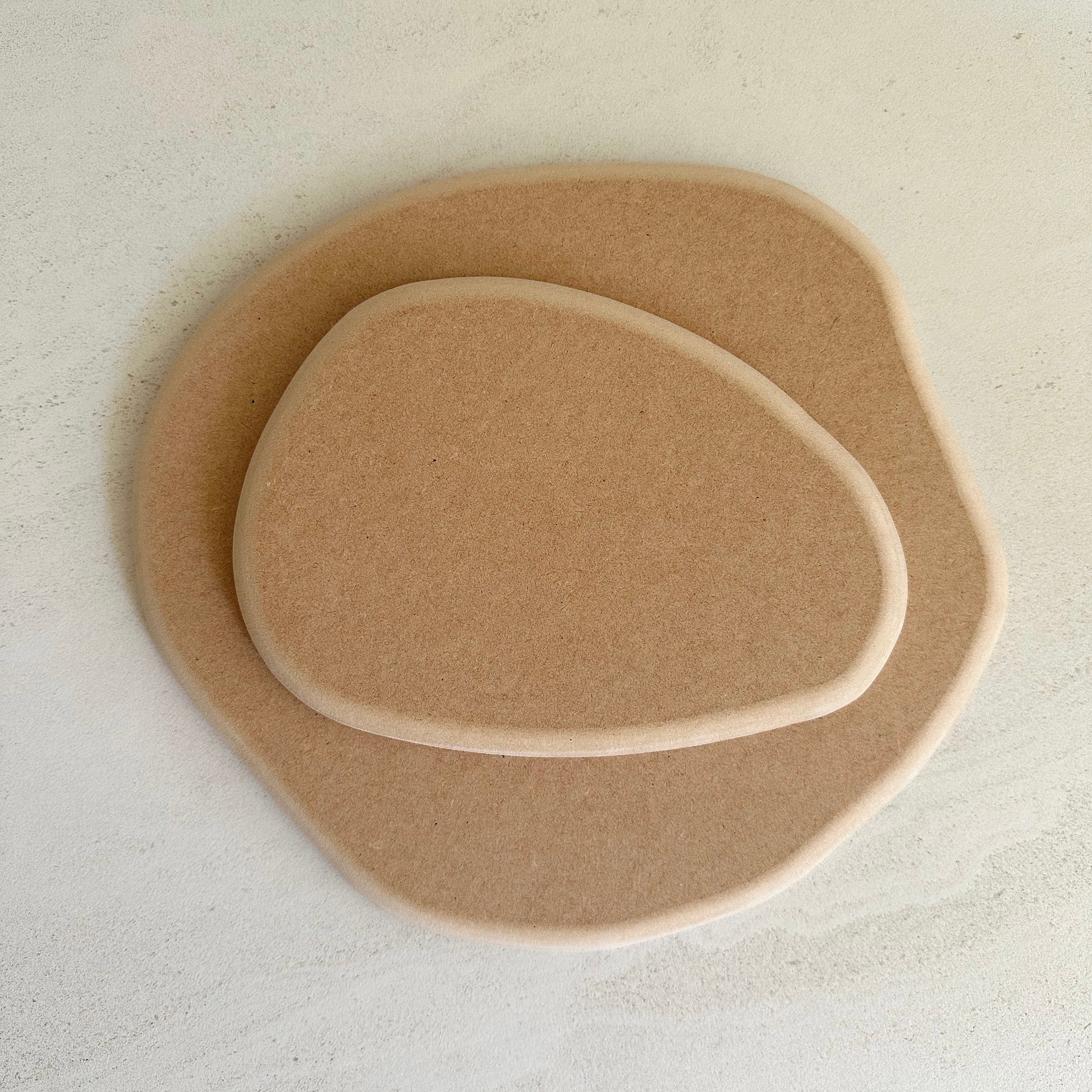 Irregular pottery forms inspired by the asymmetrical, beautifully unpredictable shapes found in nature, which are designed to nest within each other.