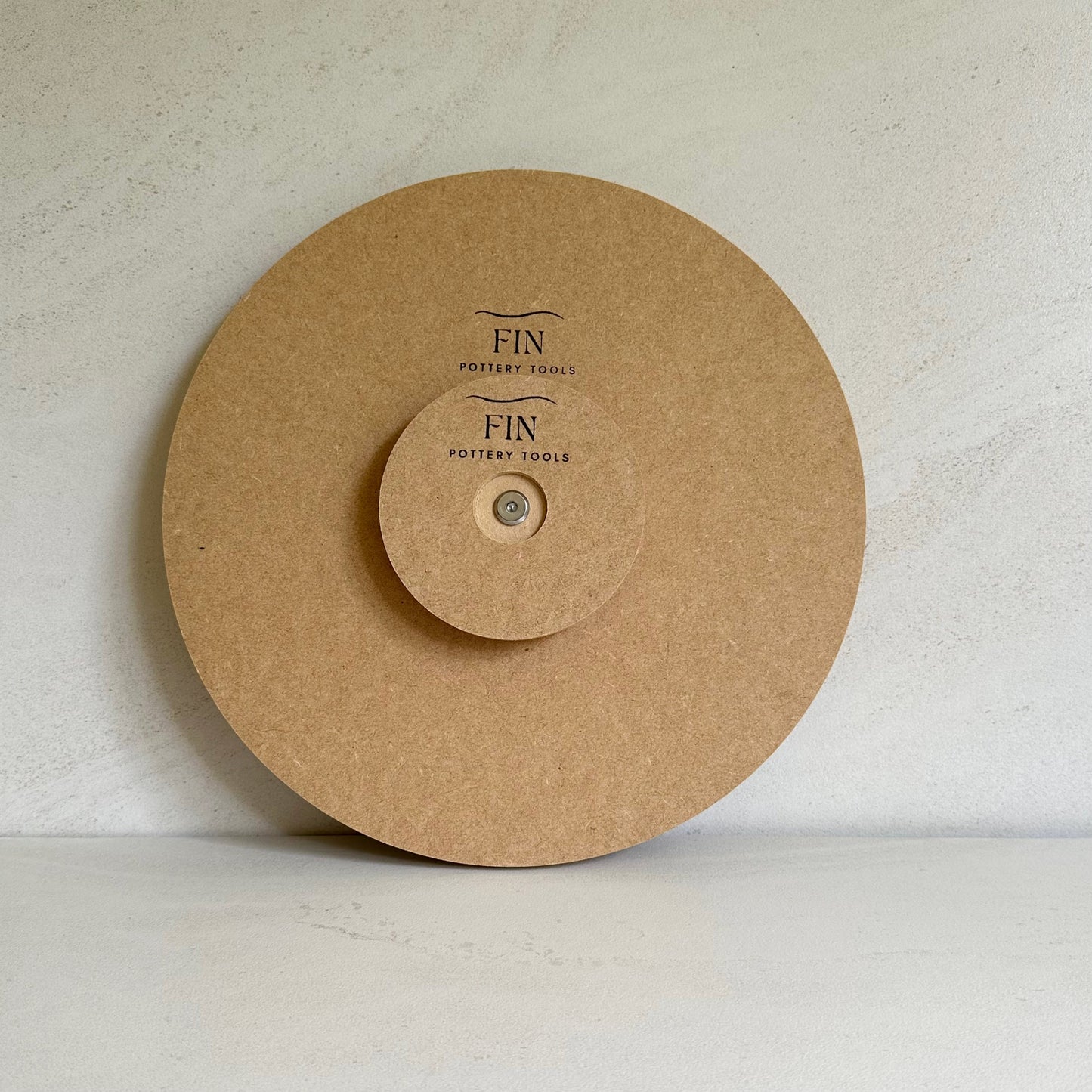 Fin Pottery Tools 30cm round pottery form with a handle attached