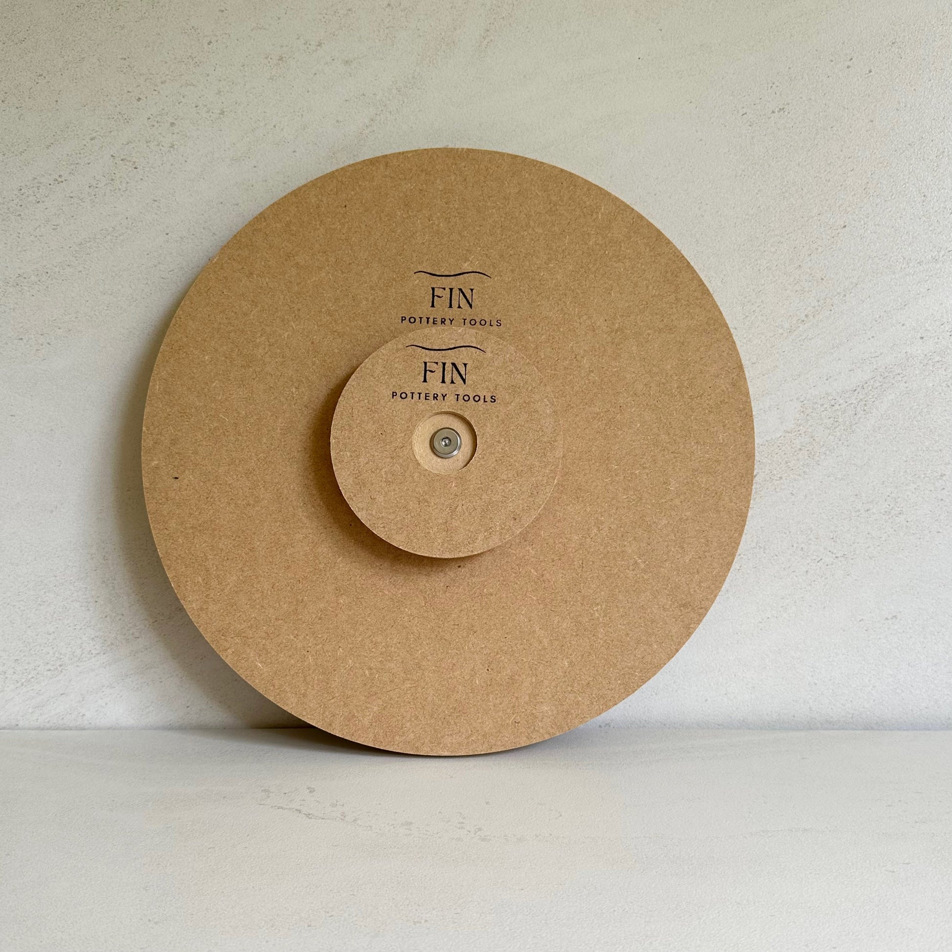 Fin Pottery Tools 30cm round pottery form with a handle attached
