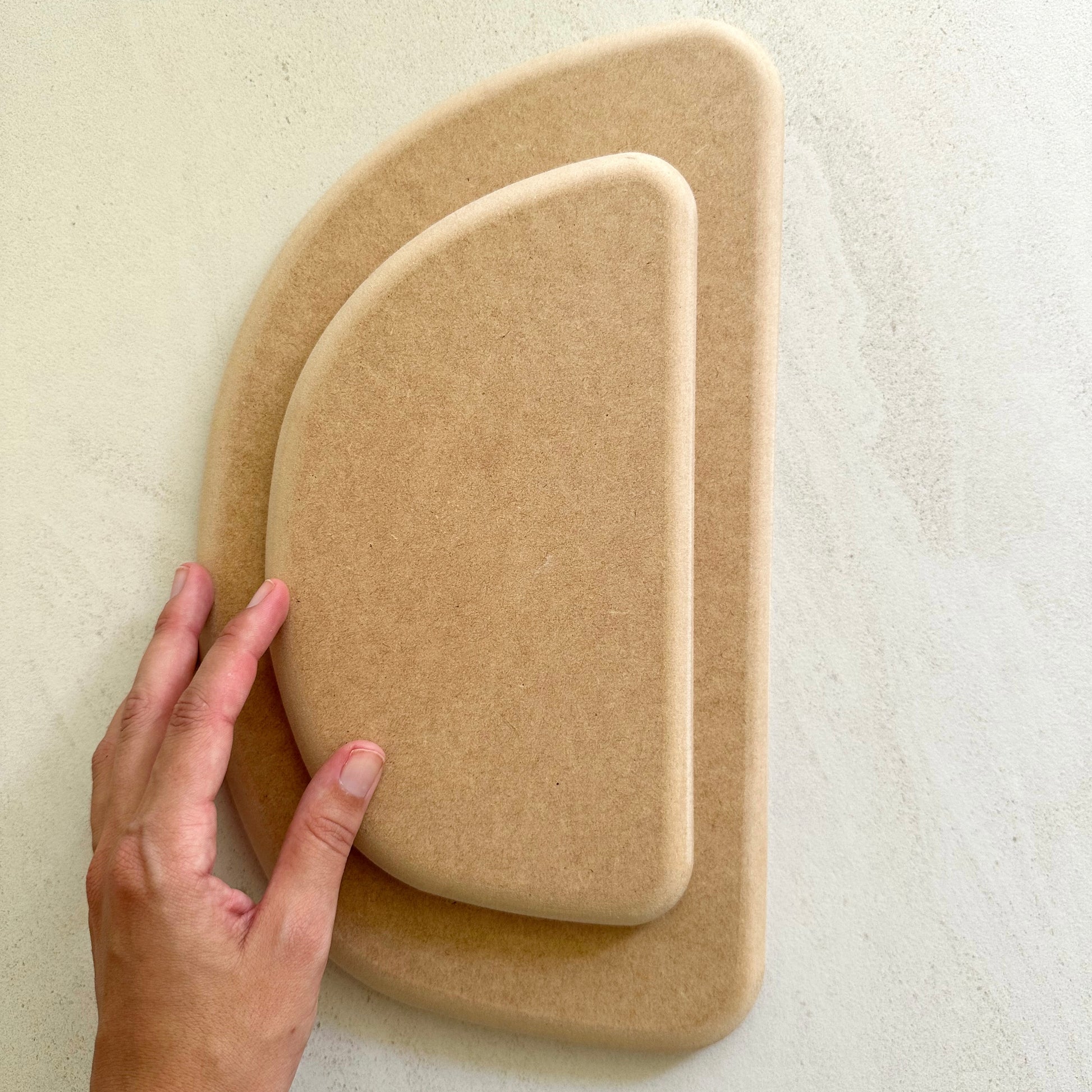 Semi-circle pottery form/drape mould with soft roundover edge. Available in two sizes.