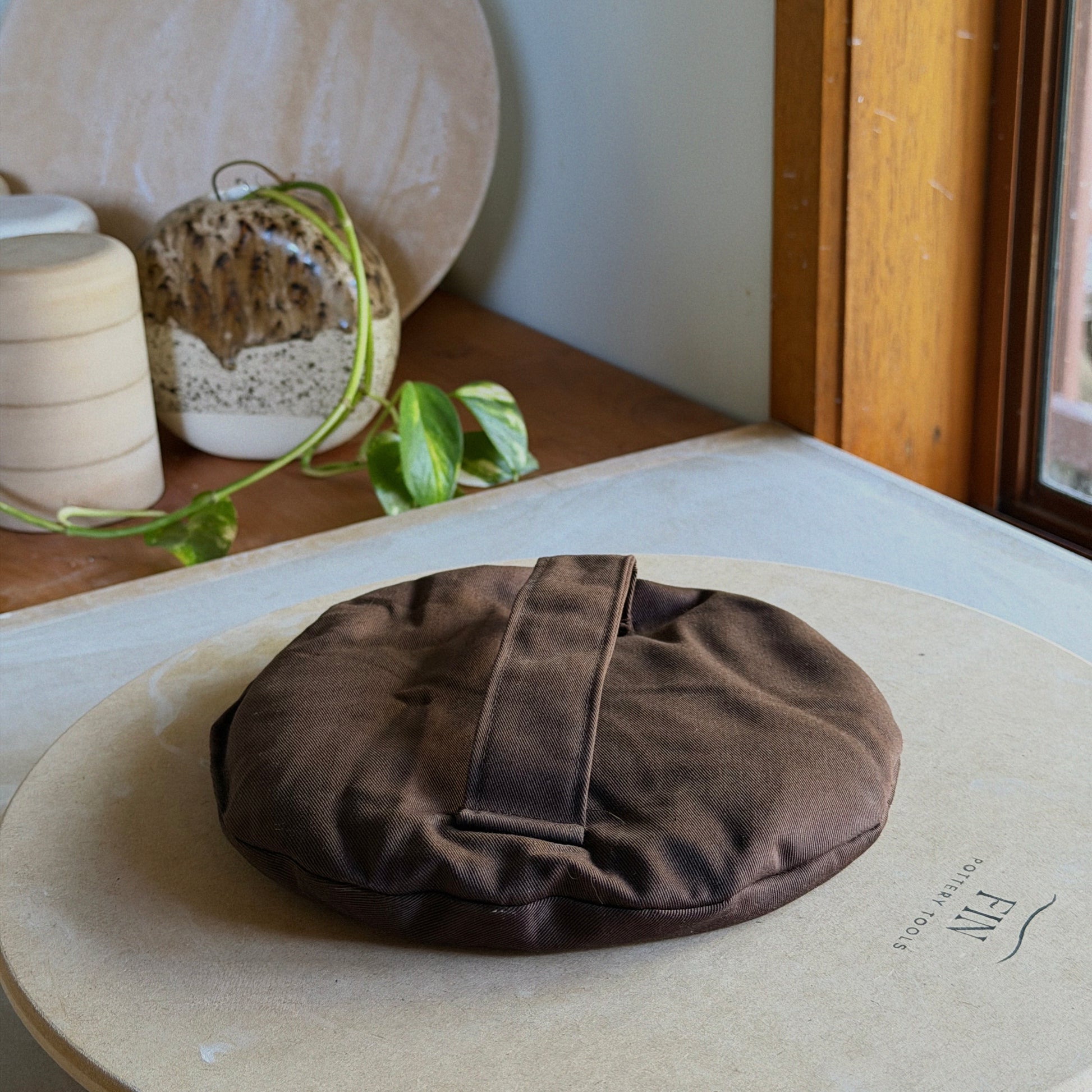 DIY sandbag on a pottery workbench