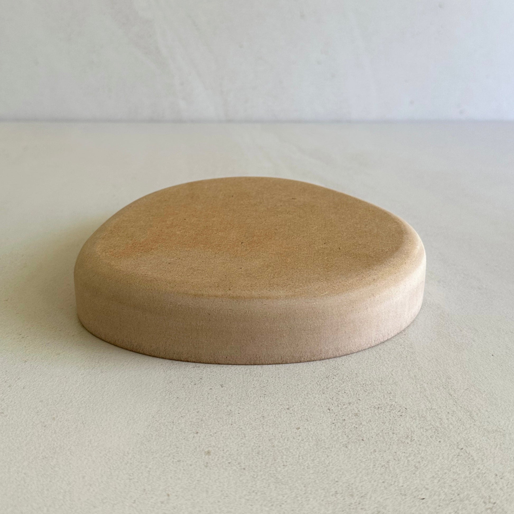 Irregular blate pottery form