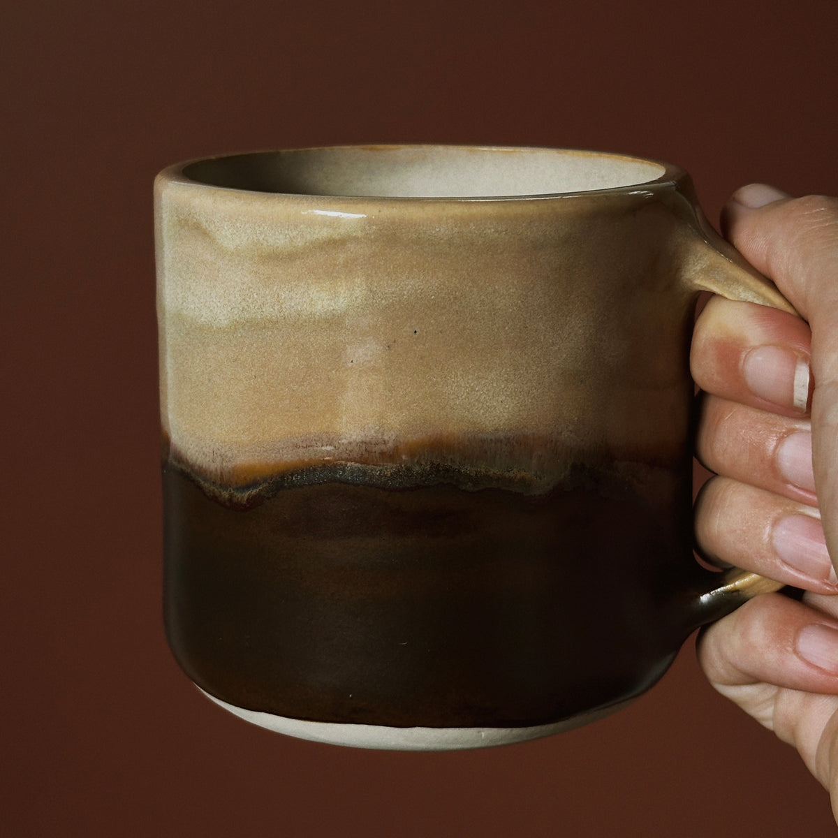 Beige and dark brown mug made with Fin Pottery Tools Mug Mould