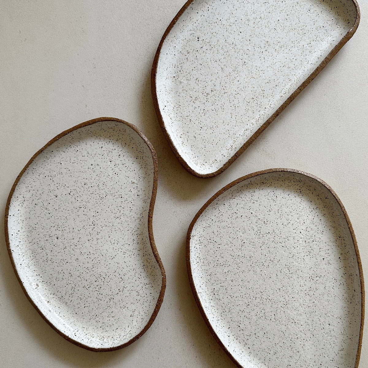 Irregular pottery forms inspired by the asymmetrical, beautifully unpredictable shapes found in nature, which are designed to nest within each other.